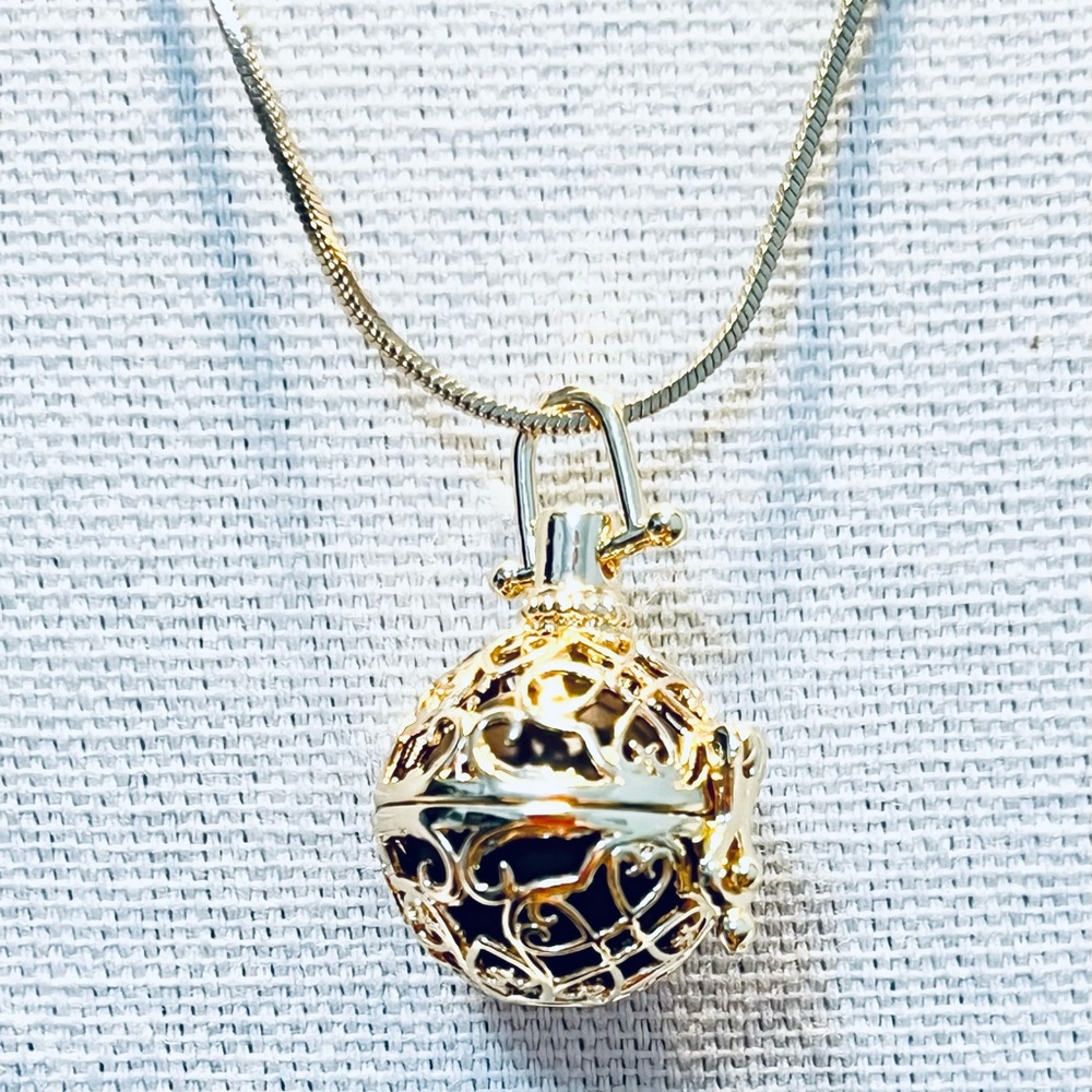 New. Golden Angel Chime necklace. 30” chain